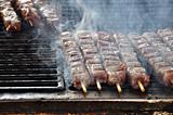 souvlaki meat skewers on hot grill