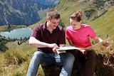 Male and female hikers in the Alps