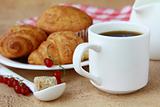 breakfast with fresh coffee, fresh croissants and fruits