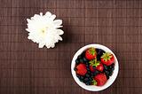light Breakfast flower and Berries on a table