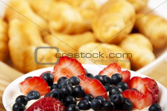 light Breakfast  croissants and Berries on a table