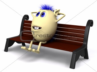 Haired puppet resting on brown park bench