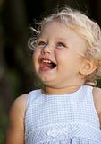 Blond baby girl laughing