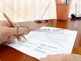 Signing a contract.