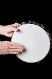 Tambourine and hands Isolated On Black
