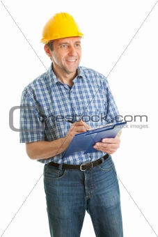 Confident worker wearing hard hat and taking notes