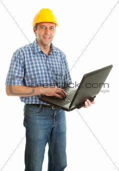 Confident worker wearing hard hat and using laptop