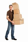 Delivery man carrying stack of boxes
