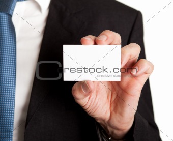 Close-up of businessman holding blank card