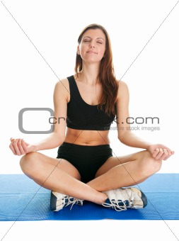 Fitness woman sitting in lotus yoga position
