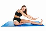 Fitness woman stretching on gym mat