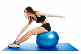 Fitness woman stretshing on fitness ball