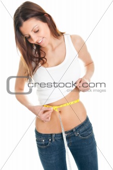 Beautiful woman measuring waist