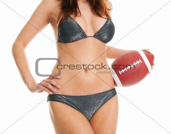 Beautilful woman posing with football ball