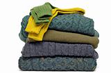 Stack of colorful fall or winter irish wool sweaters
