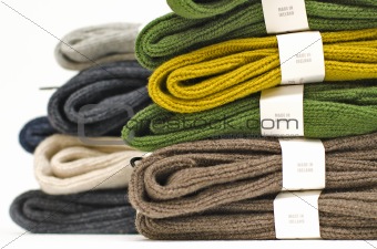 Stack of colourful fall or winter irish wool sweaters