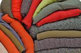 Stack of colourful fall or winter irish wool sweaters