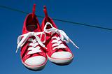 New red sneakers on washing line