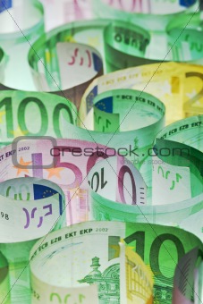 Money background - euro banknotes under lit