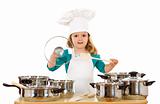 Little girl playing with cooking utensils