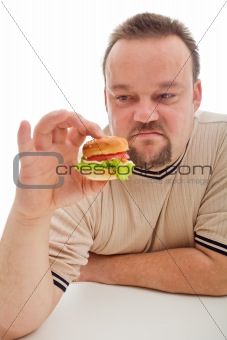 Man not happy about the size of his hamburger - closeup