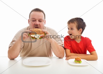 Man and boy with hamburgers