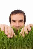 Happy man in green grass - isolated