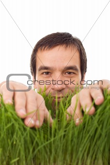 Happy man in green grass - isolated
