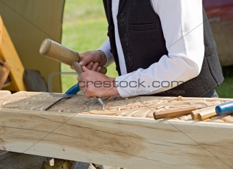 Traditional craftsman carving wood