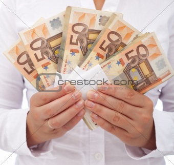 Stack of euros in woman hands