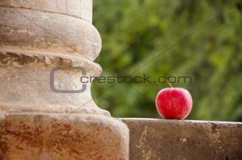 red apple and column