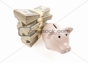 Pink Piggy Bank with Stacks of Hundreds of Dollars Isolated on a White Background.