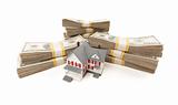 Small House with Stacks of Hundred Dollar Bills Isolated on a White Background.