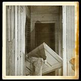 vintage photo of ghost in haunted hallway