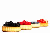 blackberries and other berries in tartlet cakes