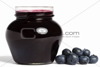 jam jar with blueberry jam and blueberries