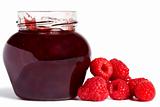 jam jar with raspberries aside