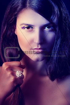 Portrait of beautiful girl with ring on hand. Retouched
