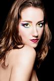 Portrait of beautiful brown hair girl with extravagant makeup. Retouched
