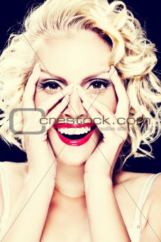 Portrait of expressive woman with hands on face. Retouched

