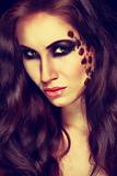 Portrait of mysterious woman with extravagant makeup. Retouched

