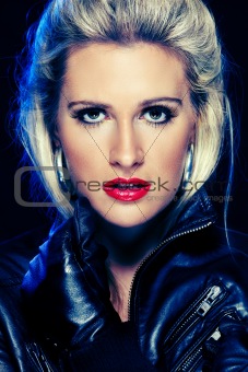 Portrait of beautiful woman in leather jacket. Retouched
