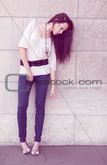 Full length fashion girl posing on street
