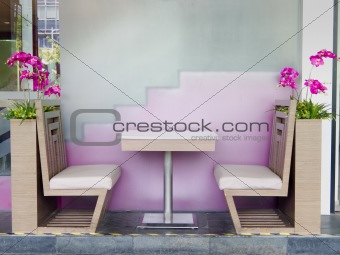 Table and chair in restaurant with flowers