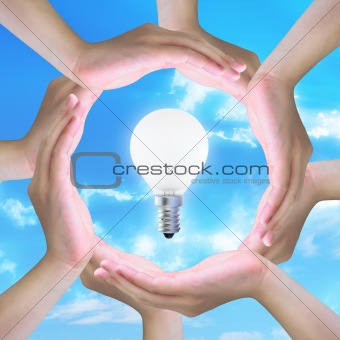 light bulb in women hand making a circle