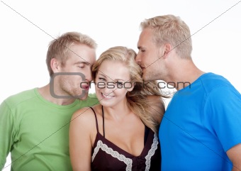 two young men flirting with a woman standing between them - isolated on white