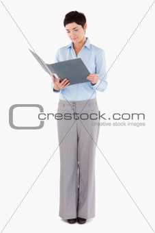 Woman looking at a binder