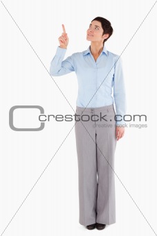 Businesswoman pointing at copy space