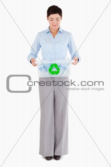 Businesswoman with a recycling box