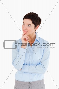 Thoughtful businesswoman with the hand on her chin